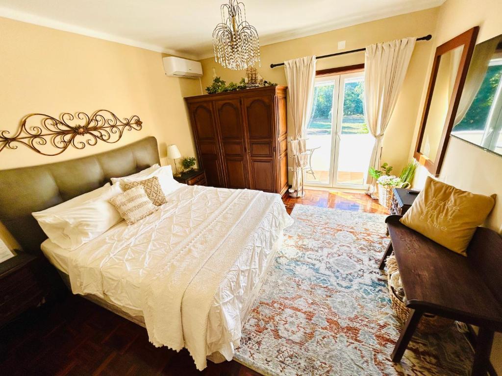 The Orchard Lookout — king bedroom with antique armoire