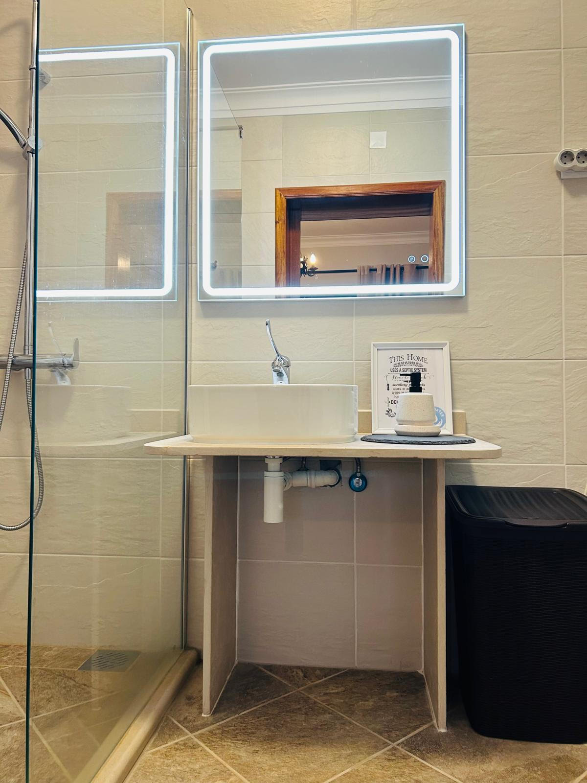 Seating area and wider view of the Sun-Kissed Suite bathroom