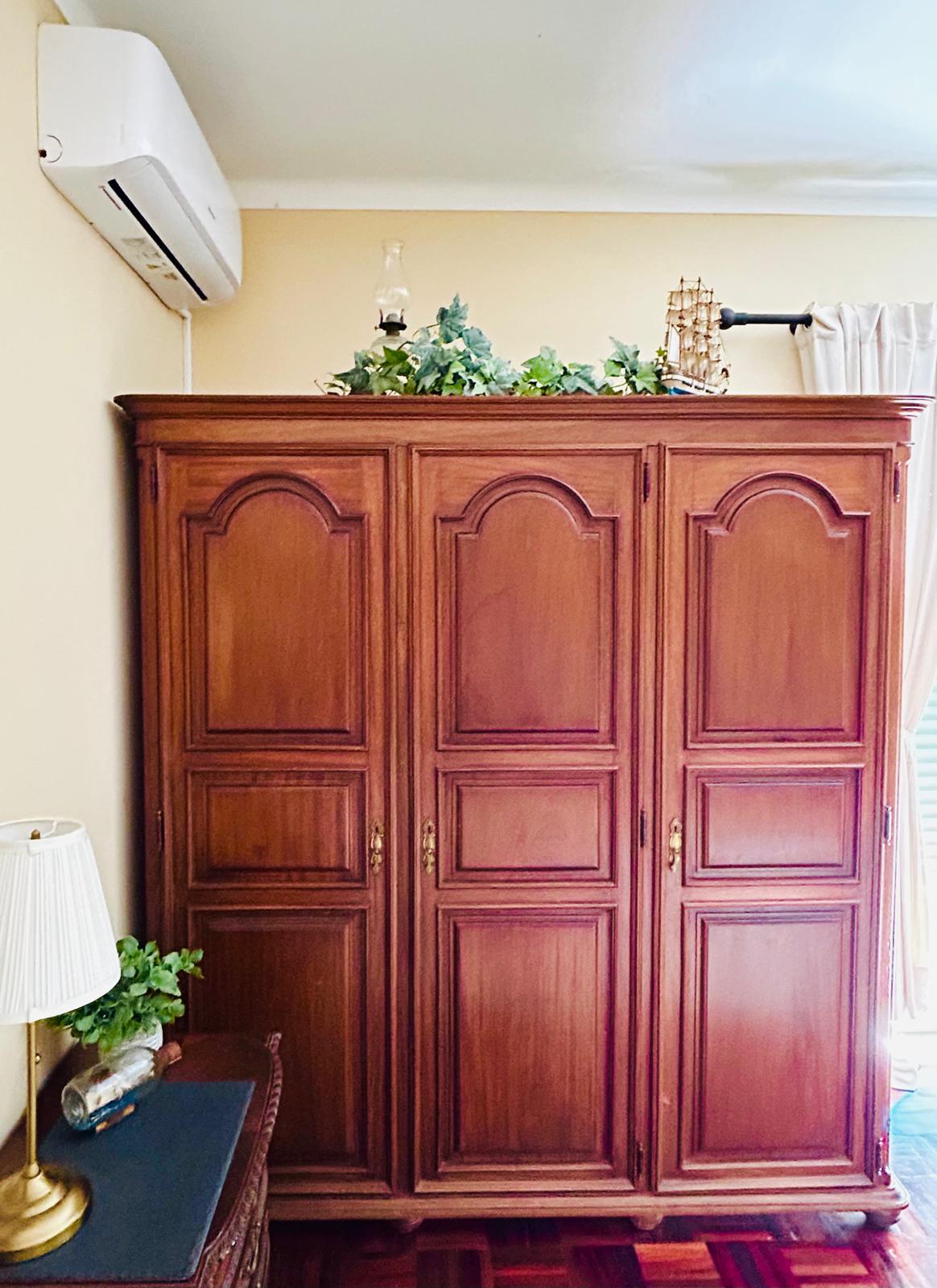 The Orchard Lookout — antique three-door mahogany armoire